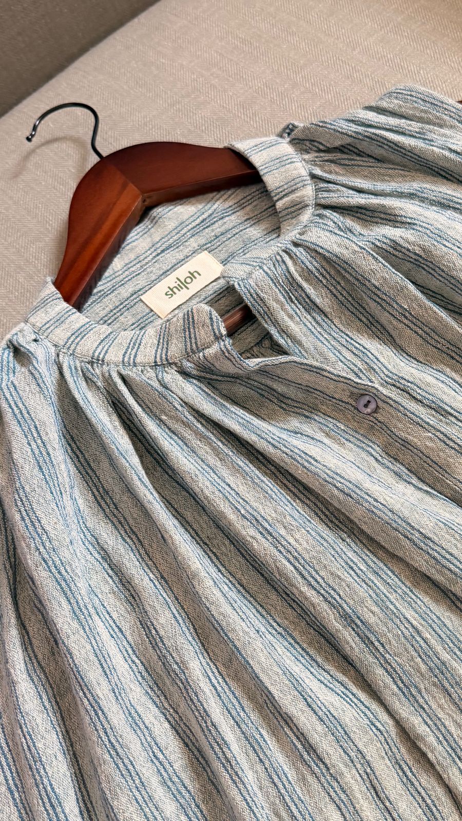 Sleeveless handwoven cotton striped top in blue with button-down front.