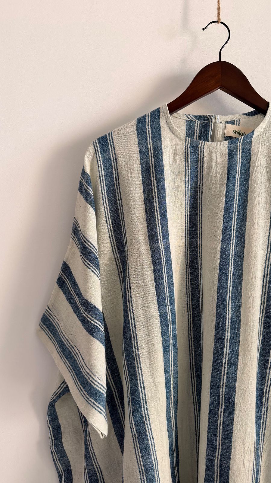 Relaxed silhouette of striped oat and indigo handloom cotton dress.