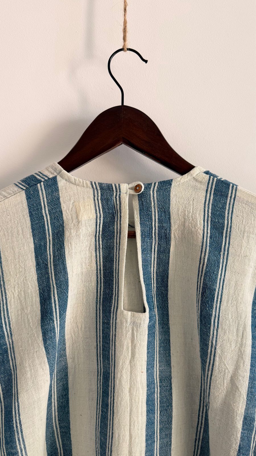 Close-up of indigo woven stripes on oat cotton fabric.