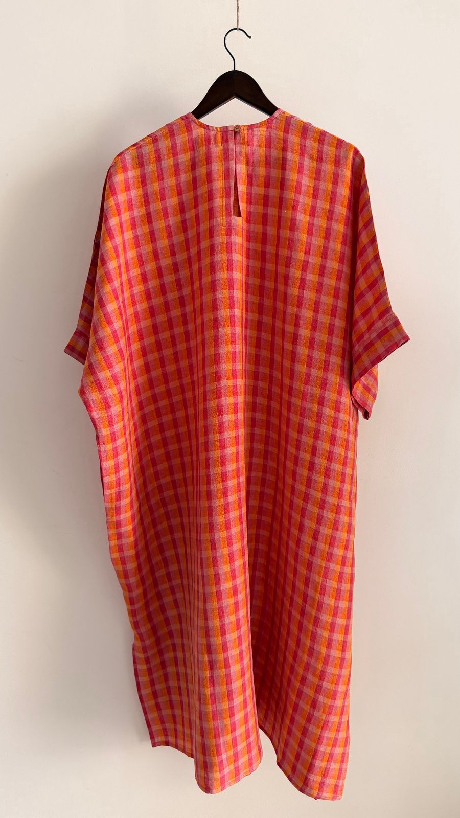 Sycamore dress in Berry Sunset – back view of handwoven linen check dress with wide sleeves.