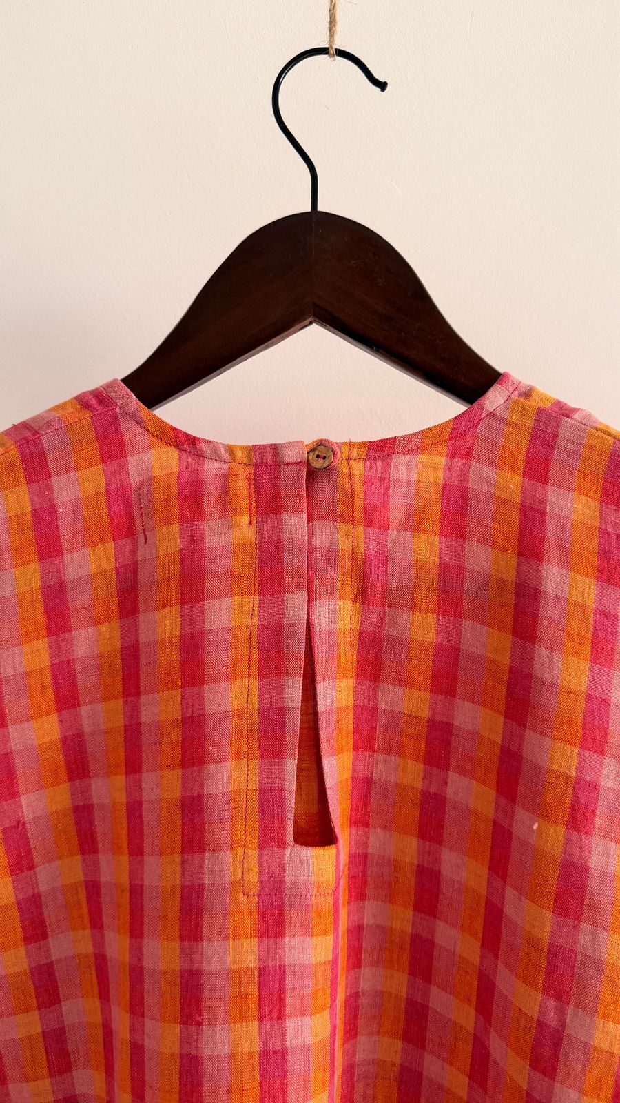 Sycamore dress in Berry Sunset – keyhole back with button closure in pink and orange check linen.