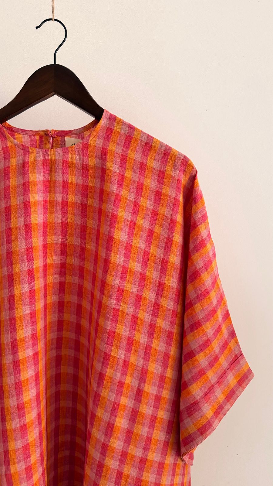 Sycamore dress in Berry Sunset – round neckline and handwoven pink and orange check linen fabric.