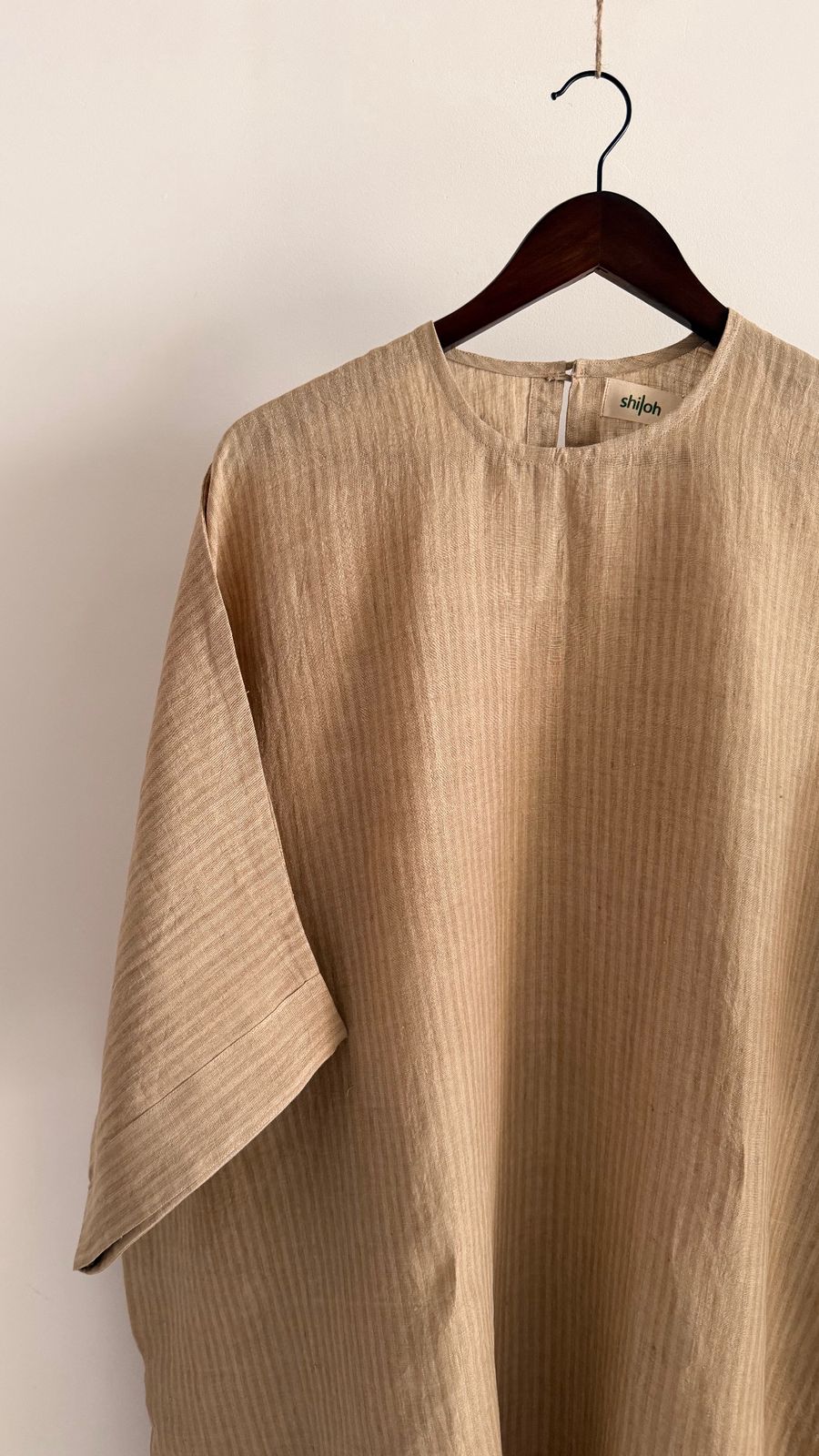 Sycamore dress in Kora Sand – minimalist handwoven linen dress with wide sleeves and relaxed silhouette.