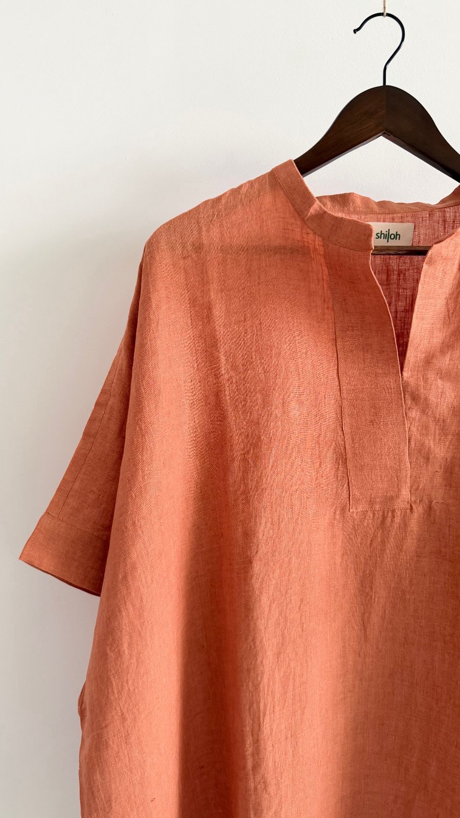 Relaxed fit tangerine linen dress with notch neckline and airy handwoven texture