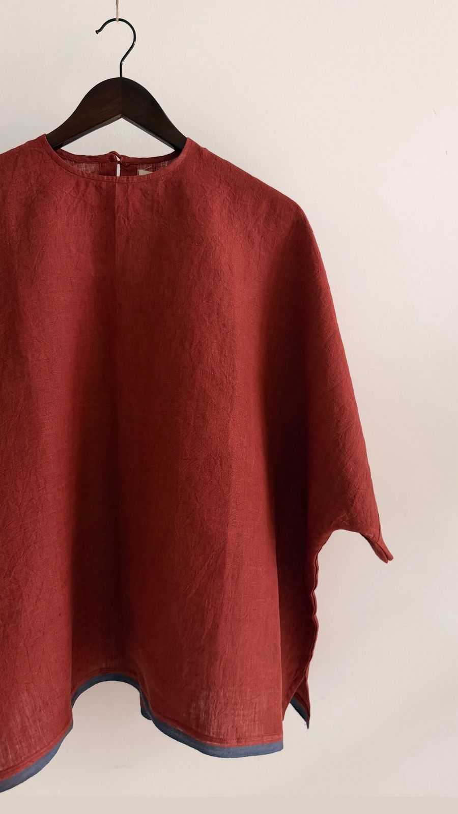 Handwoven linen top in burnt berry red with relaxed boxy silhouette