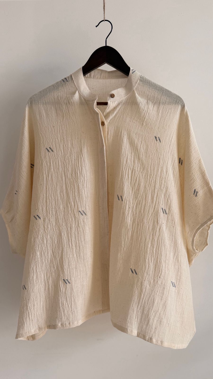 Handwoven cotton top in undyed natural fabric with small ink motifs