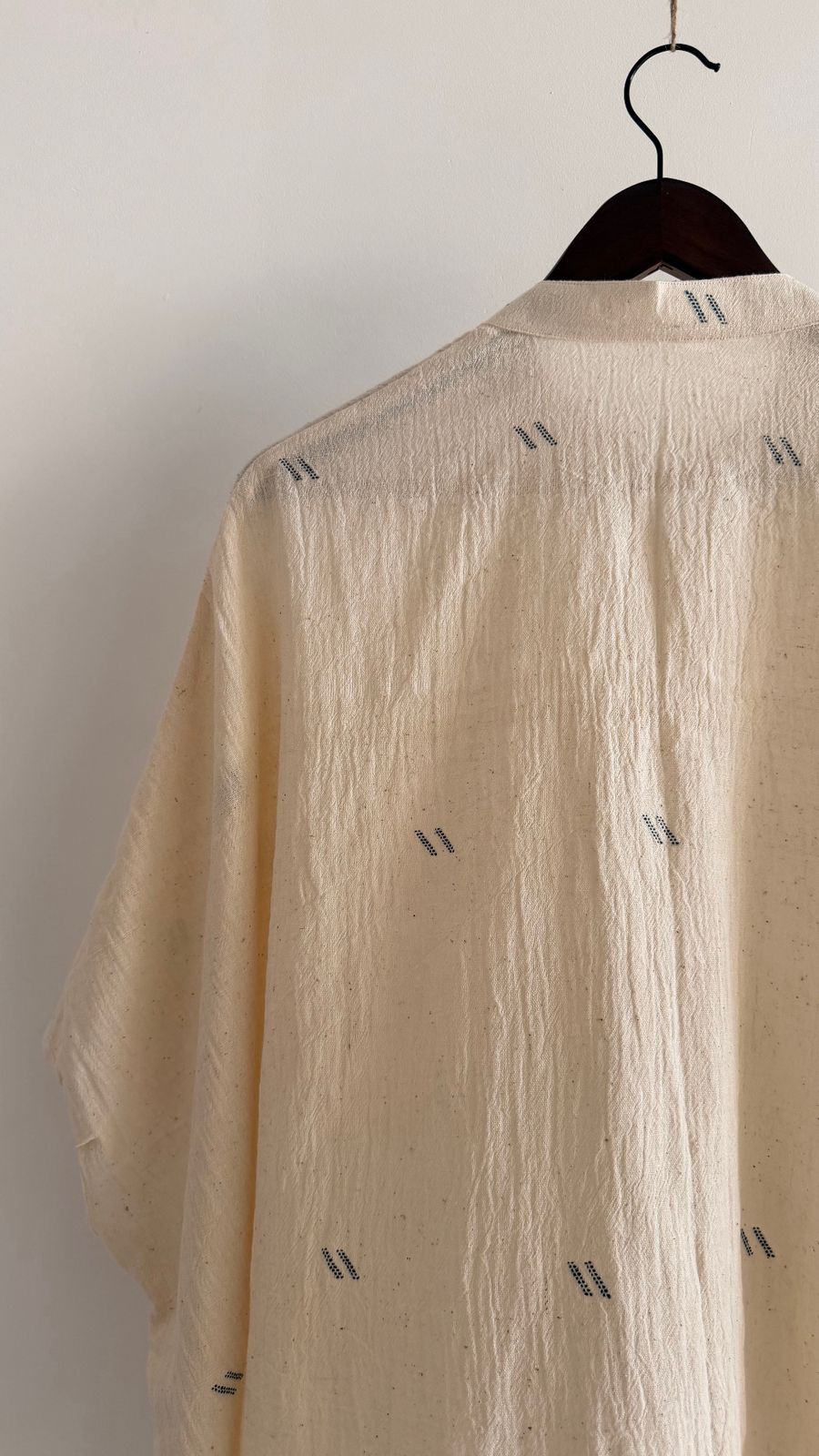 Undyed cotton top with subtle texture and artisanal weave details