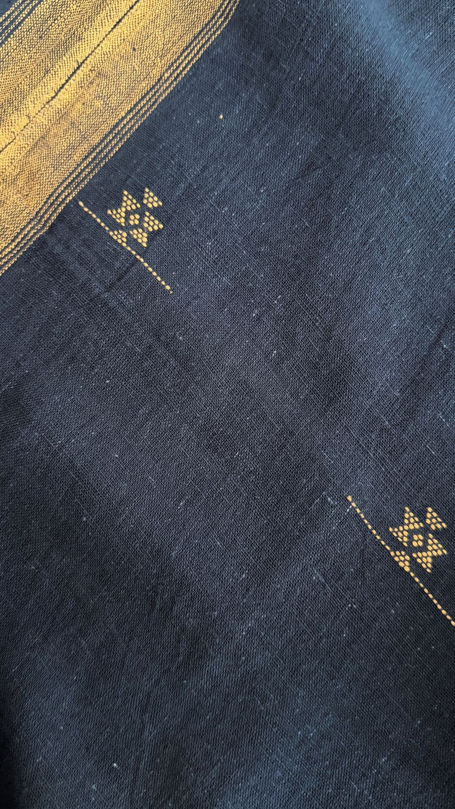 Navy handwoven kaftan with amber borders and Jamdani motifs.