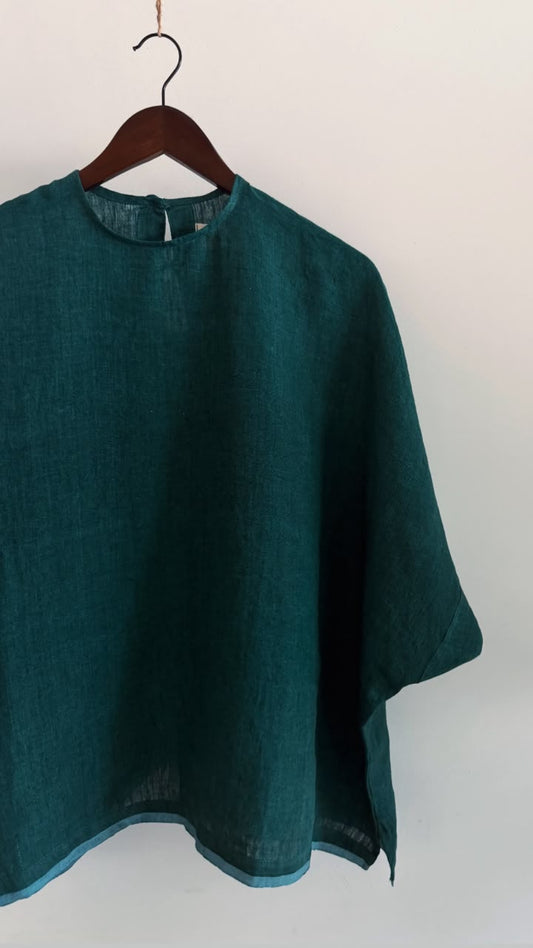 Elm top in forest green handwoven linen with a relaxed oversized silhouette, crafted from breathable natural linen.