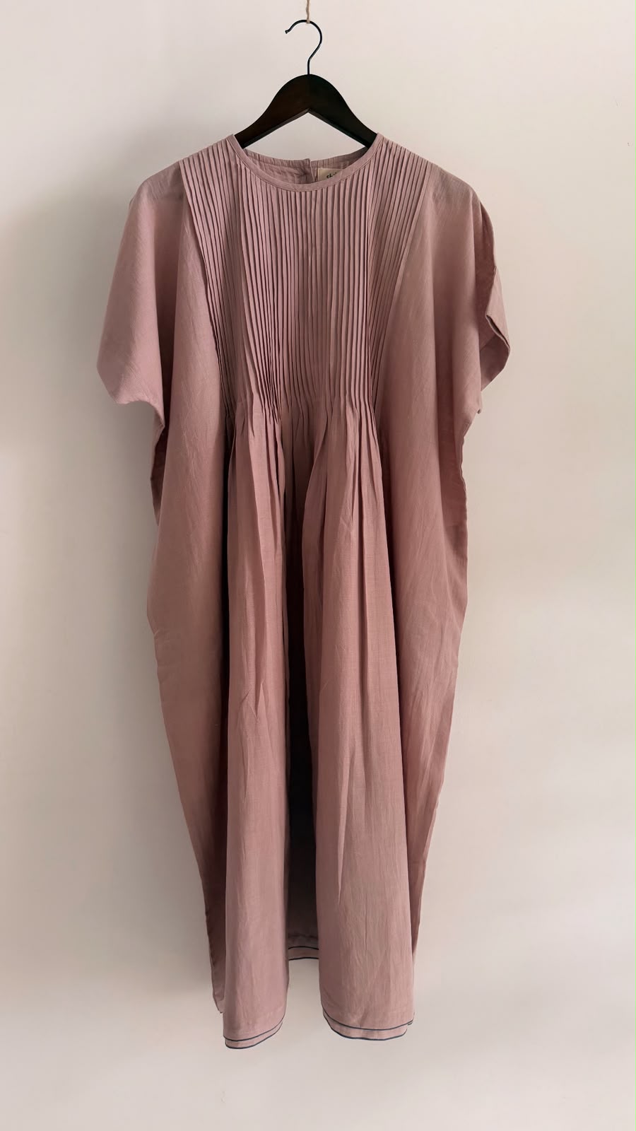 Front view of Balm dress in muted mauve handwoven khadi with fine pintuck detailing.