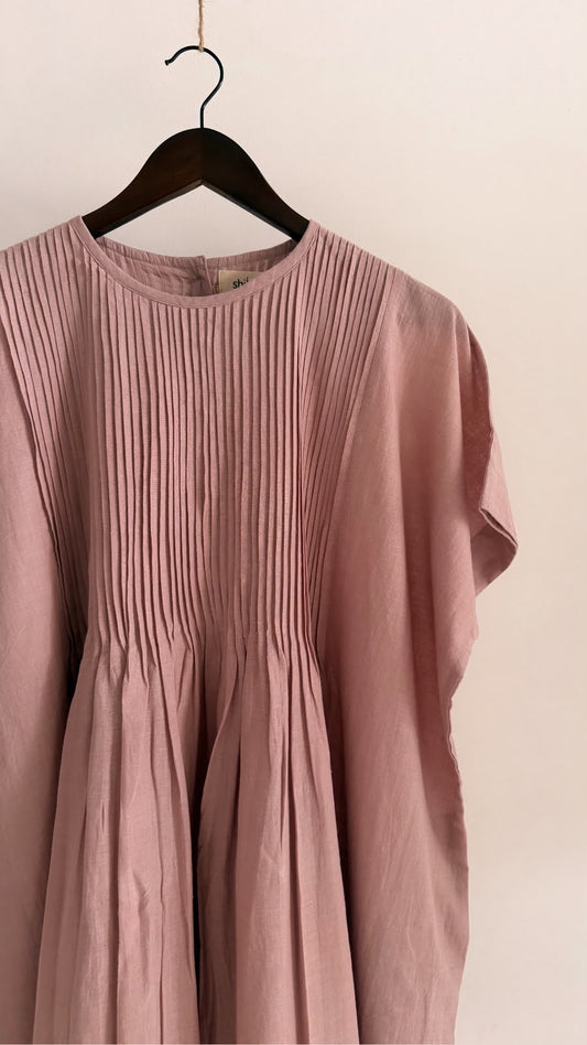 Detail of the front pintuck panel on the Balm dress in muted mauve handwoven khadi.