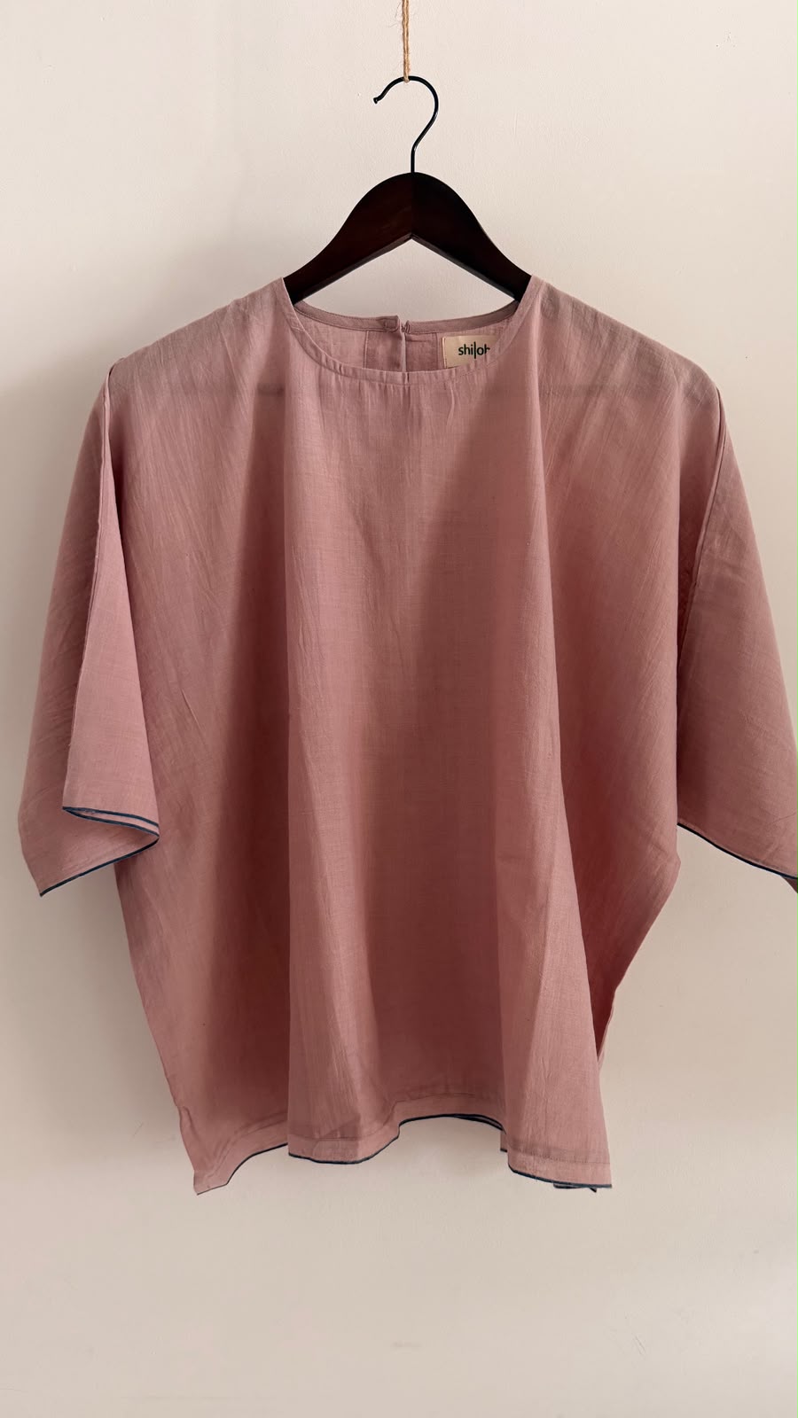 Front view of the Rue handwoven cotton top in muted mauve with contrast navy selvedge and a relaxed silhouette.