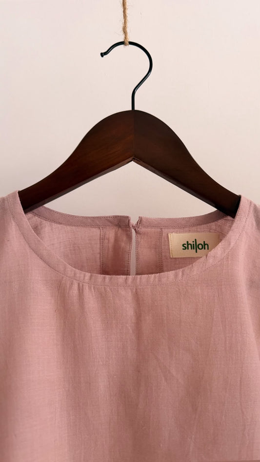 Close-up of the Rue handwoven cotton top in muted mauve featuring a clean round neckline and soft woven texture.