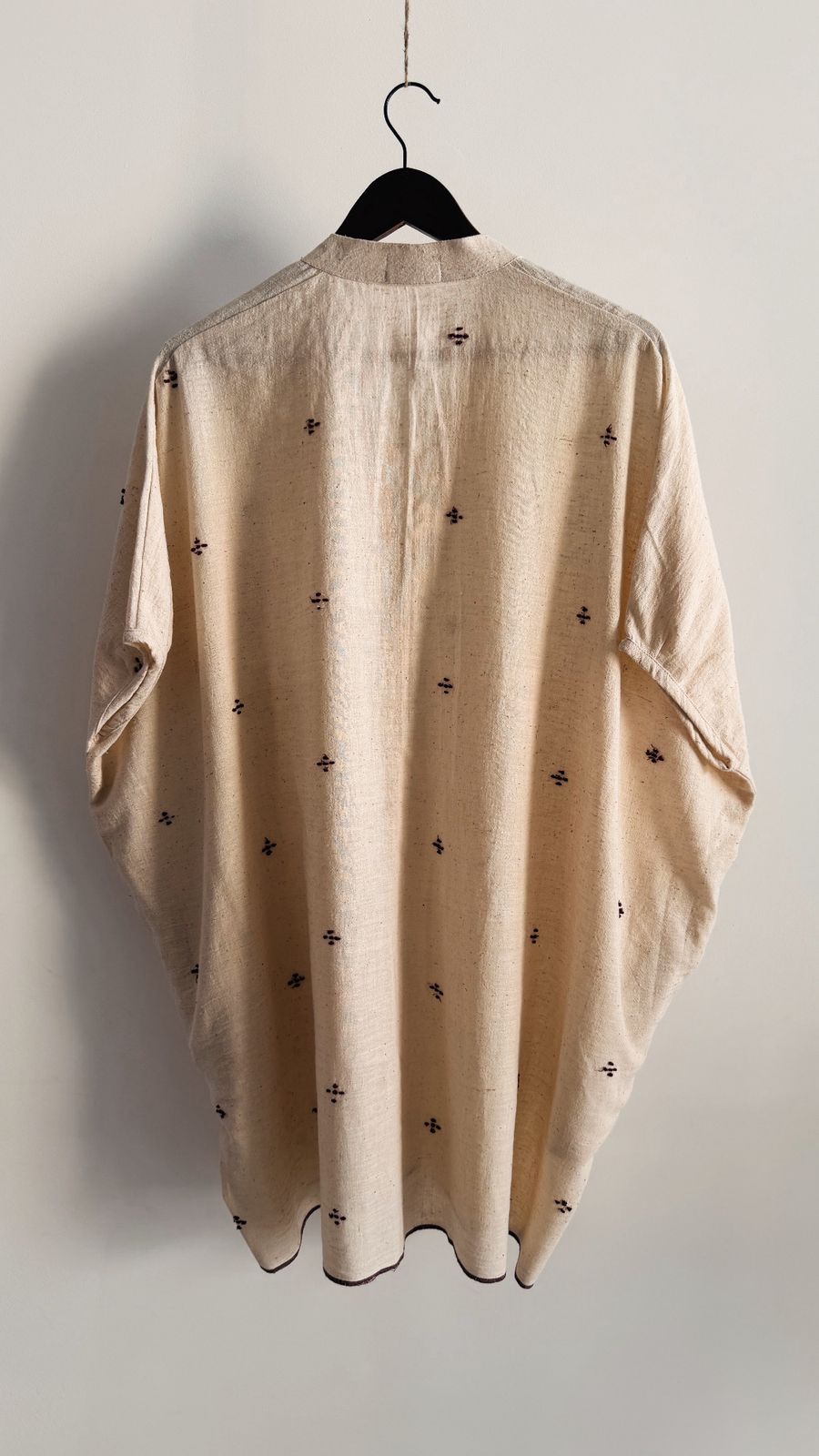 Handwoven cotton short dress with button-down front and relaxed fit.