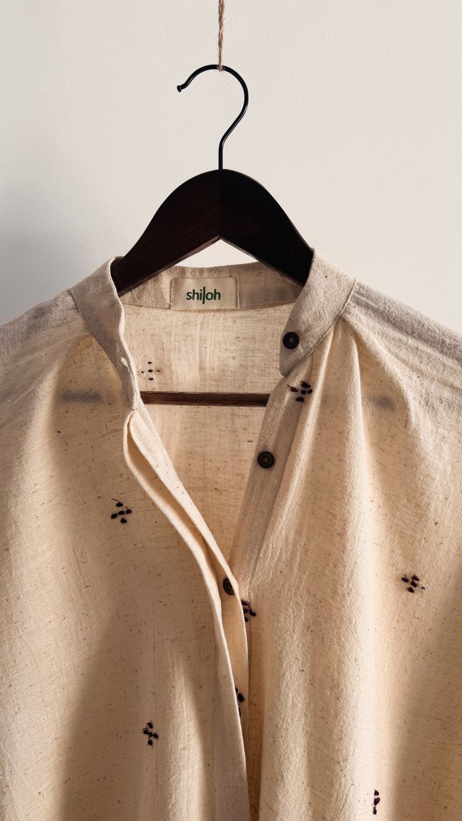 Handwoven cotton short dress with button-down front and relaxed fit.