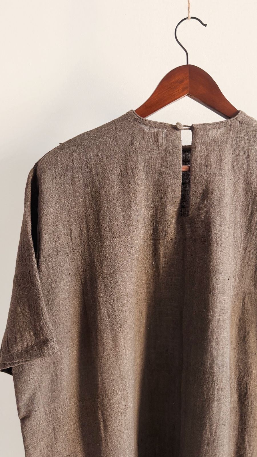 Dark grey relaxed-fit khadi cotton dress with hand-done French knot detailing on the yoke